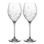 Two wine glasses with leaf pattern on a white background