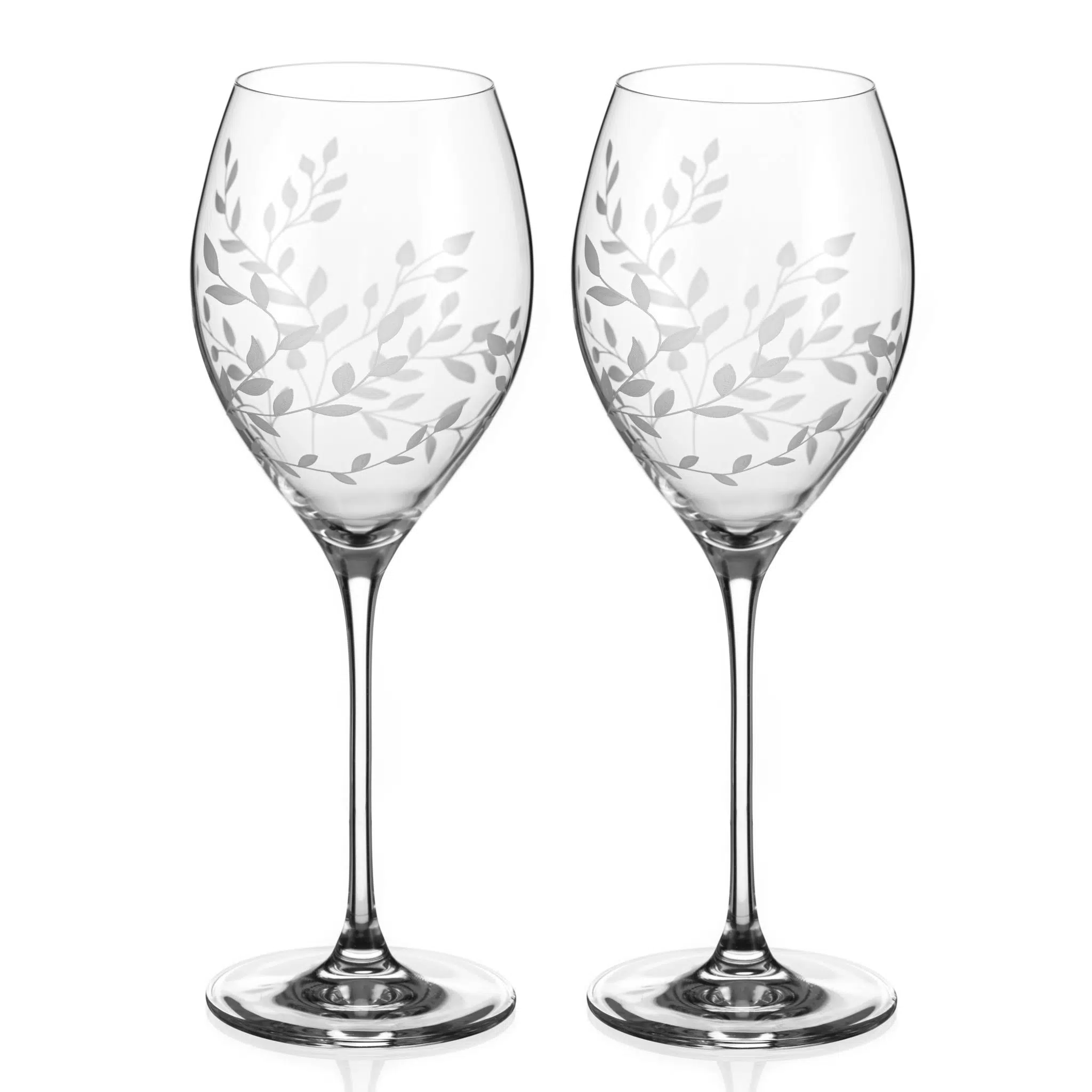 Two wine glasses with leaf pattern on a white background