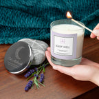 Candle labeled 'Sleep Well' being lit with lavender flowers and a tea bag on a wooden surface.