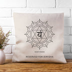 Beige pillow with a symbol and text on a wooden surface and white brick wall background
