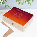 Wooden box with 'Happy Diwali' and Ganesha design on a light background