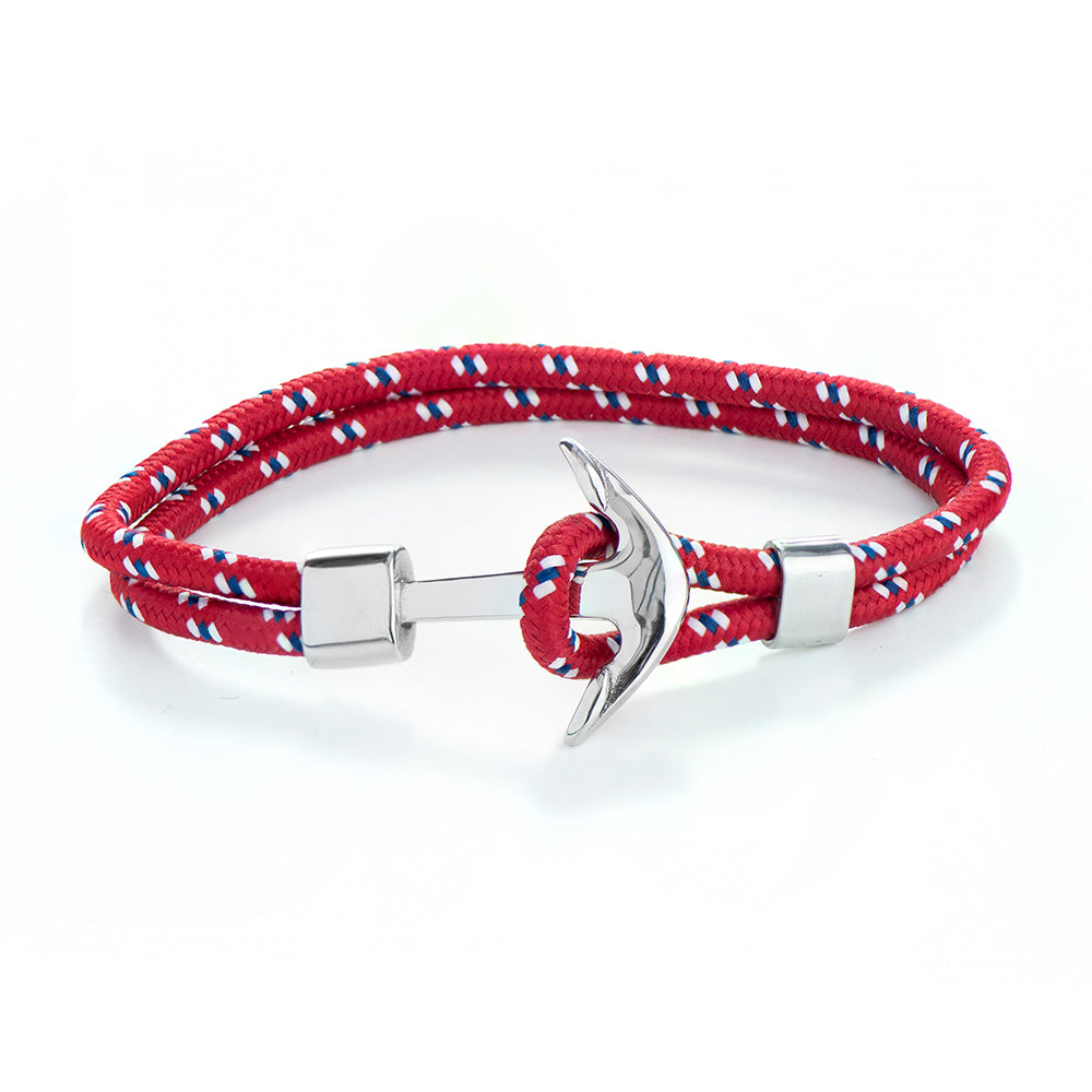 Red, white, and blue braided bracelet with a silver anchor clasp on a white background