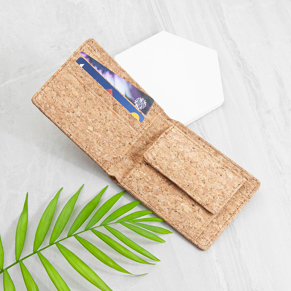 Cork wallet with card holder on a light background with a green leaf