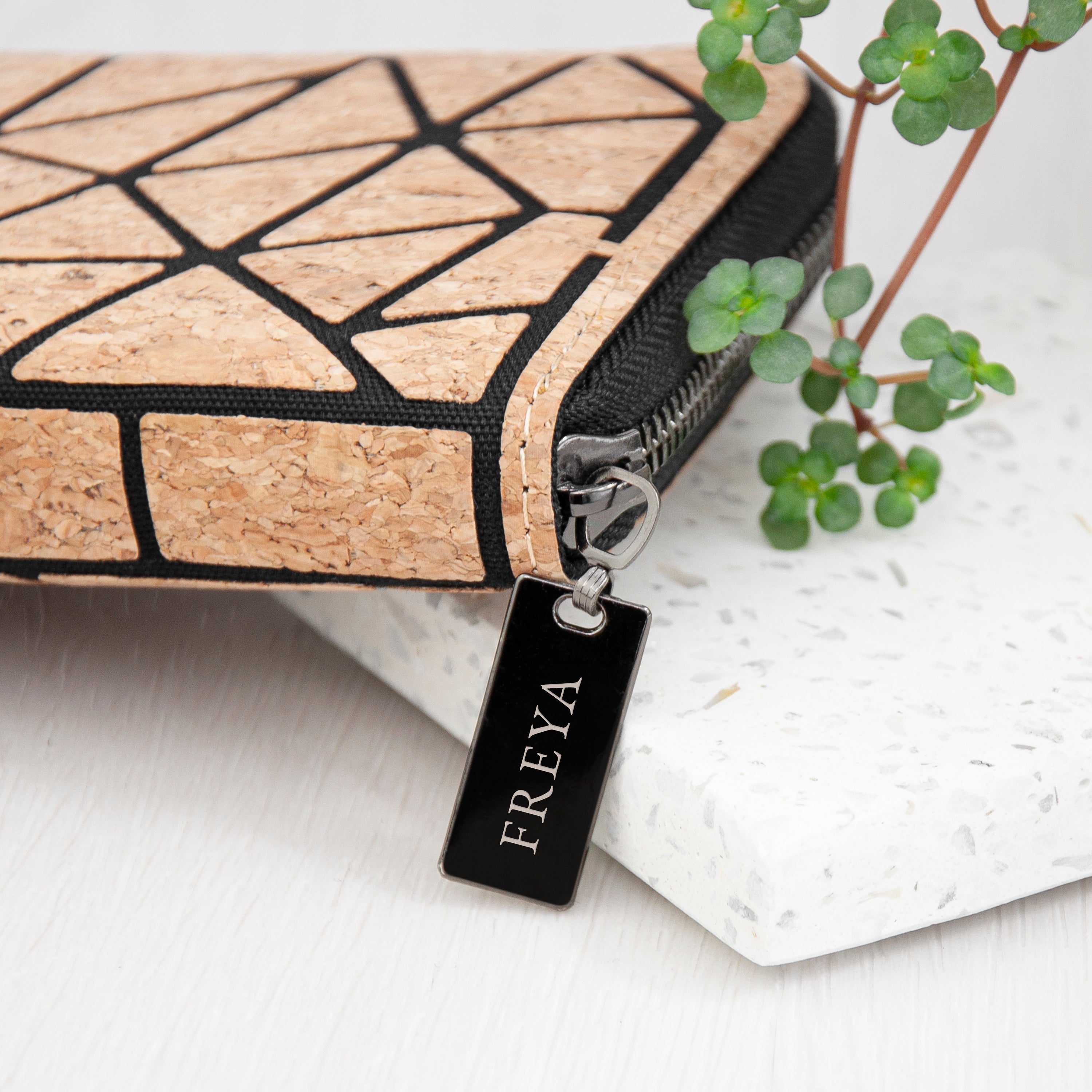 Cork wallet with geometric pattern and 'FREYA' tag on a light background