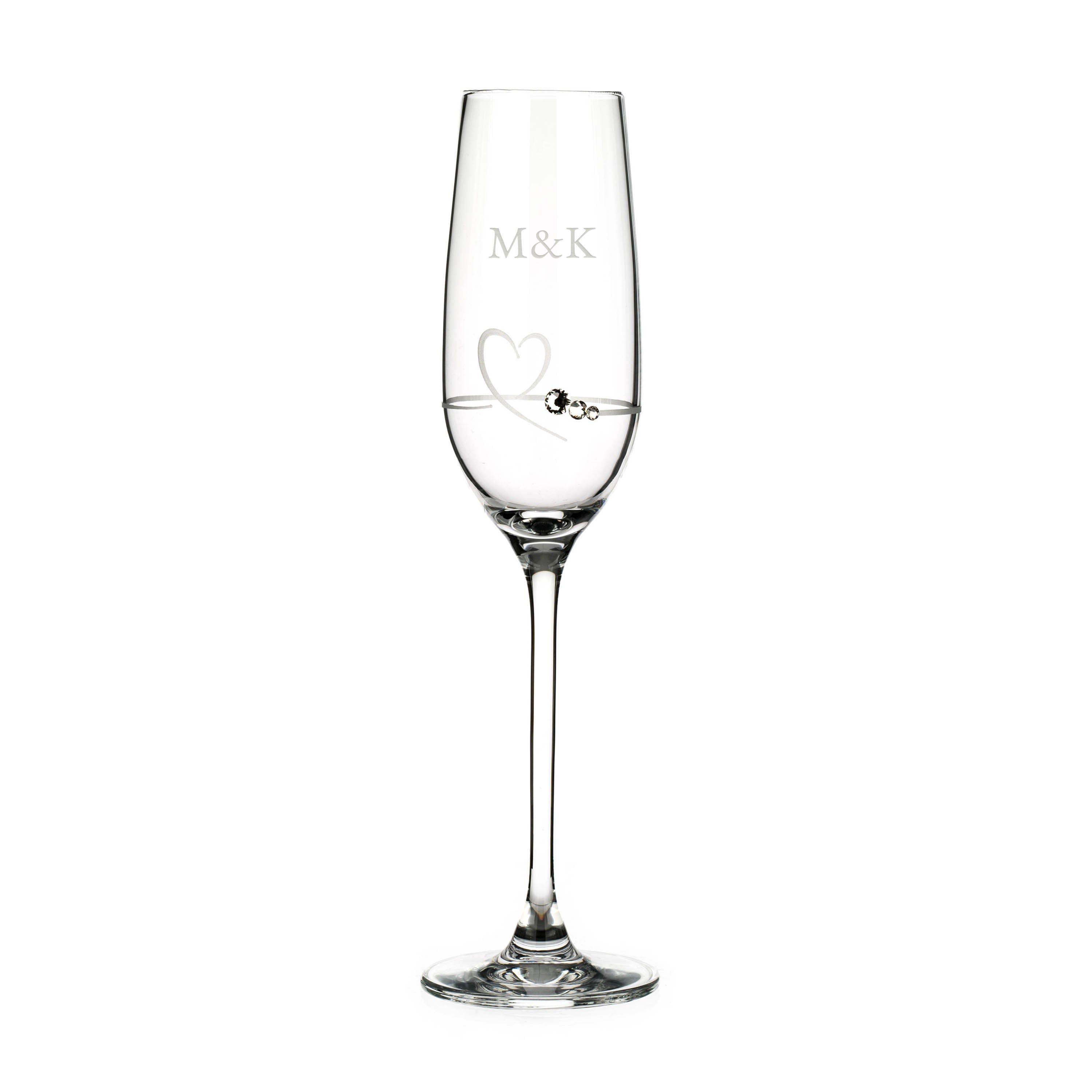 Clear champagne flute with 'M&K' engraving on a white background