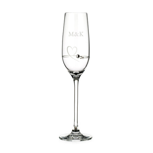 Clear champagne flute with 'M&K' engraving on a white background