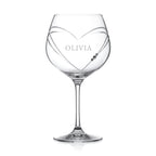 Clear wine glass with 'OLIVIA' engraved on a white background