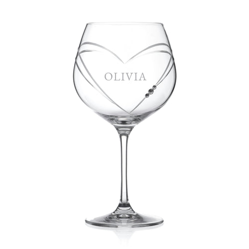 Clear wine glass with 'OLIVIA' engraved on a white background