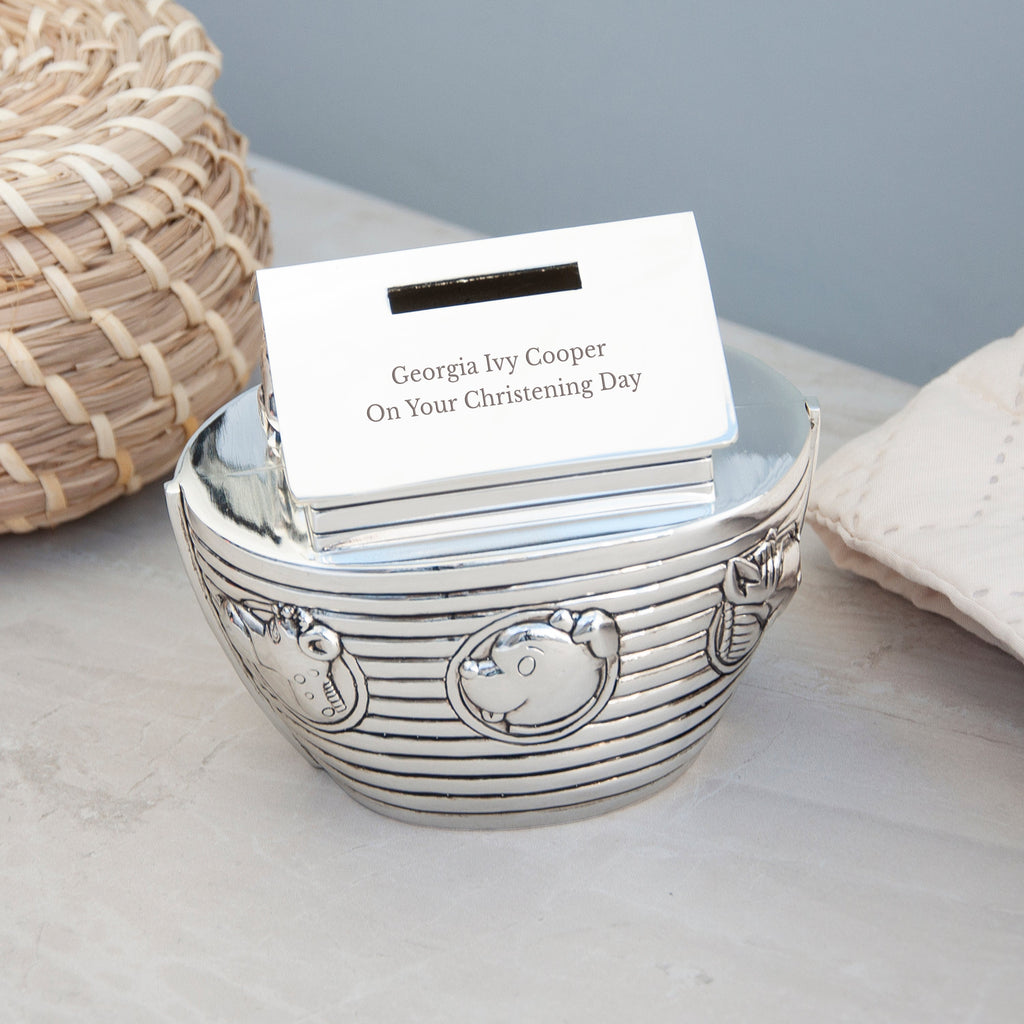 Silver decorative bowl with a card inside on a light surface
