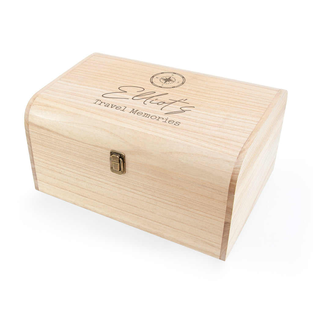 Wooden box with 'Eliot's Travel Memories' engraving on a white background