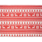 Red and white patterned fabric with reindeer and snowflake design