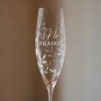 Champagne flute with 'Mr Fraser' engraving on a gradient background
