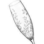Clear glass flute with leaf pattern on a white background