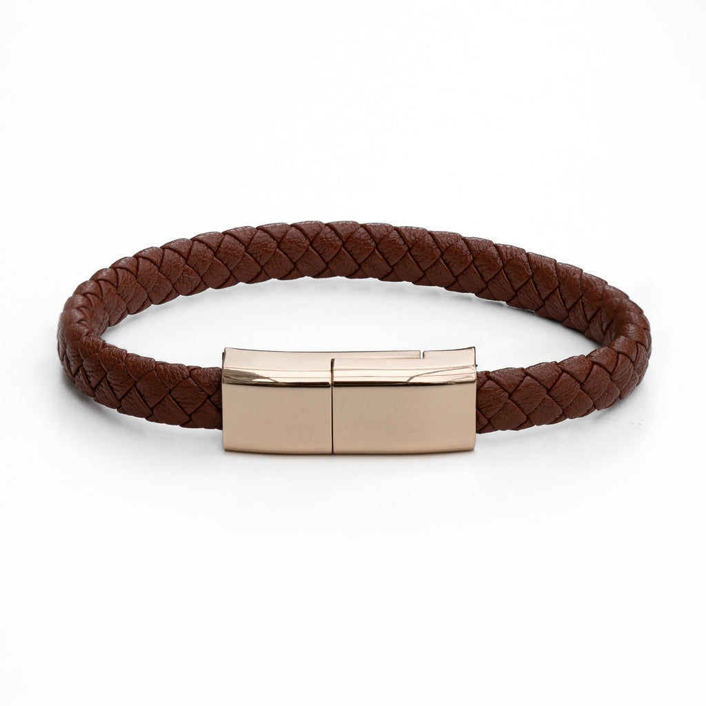 Brown braided leather bracelet with rose gold clasp on a white background