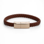 Brown braided leather bracelet with rose gold clasp on a white background
