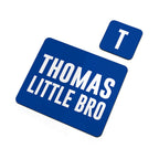Blue sign with 'THOMAS LITTLE BRO' text and a smaller 'T' sign on a white background