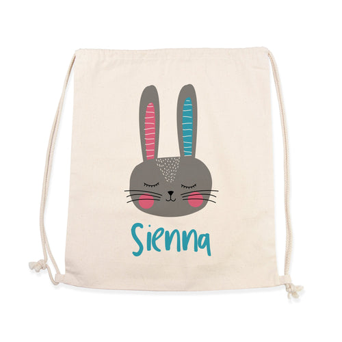 Drawstring bag with a cartoon bunny face and the name 'Sienna' on a white background