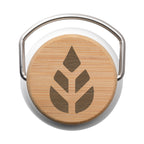 Round bamboo product with a metal handle on a white background