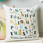 Decorative pillow with alphabet design and animal illustrations on a neutral background