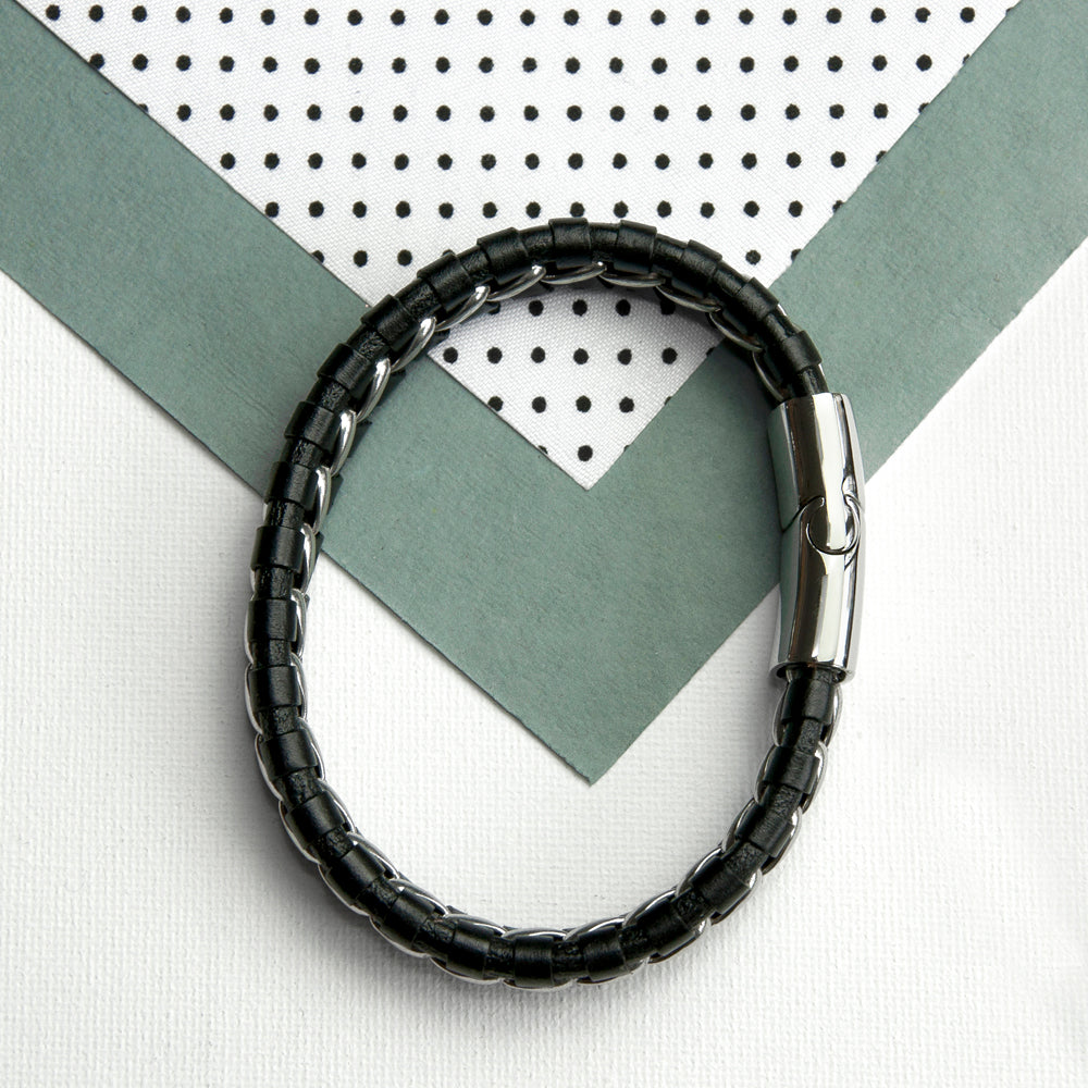Black beaded bracelet on a white background with geometric patterns