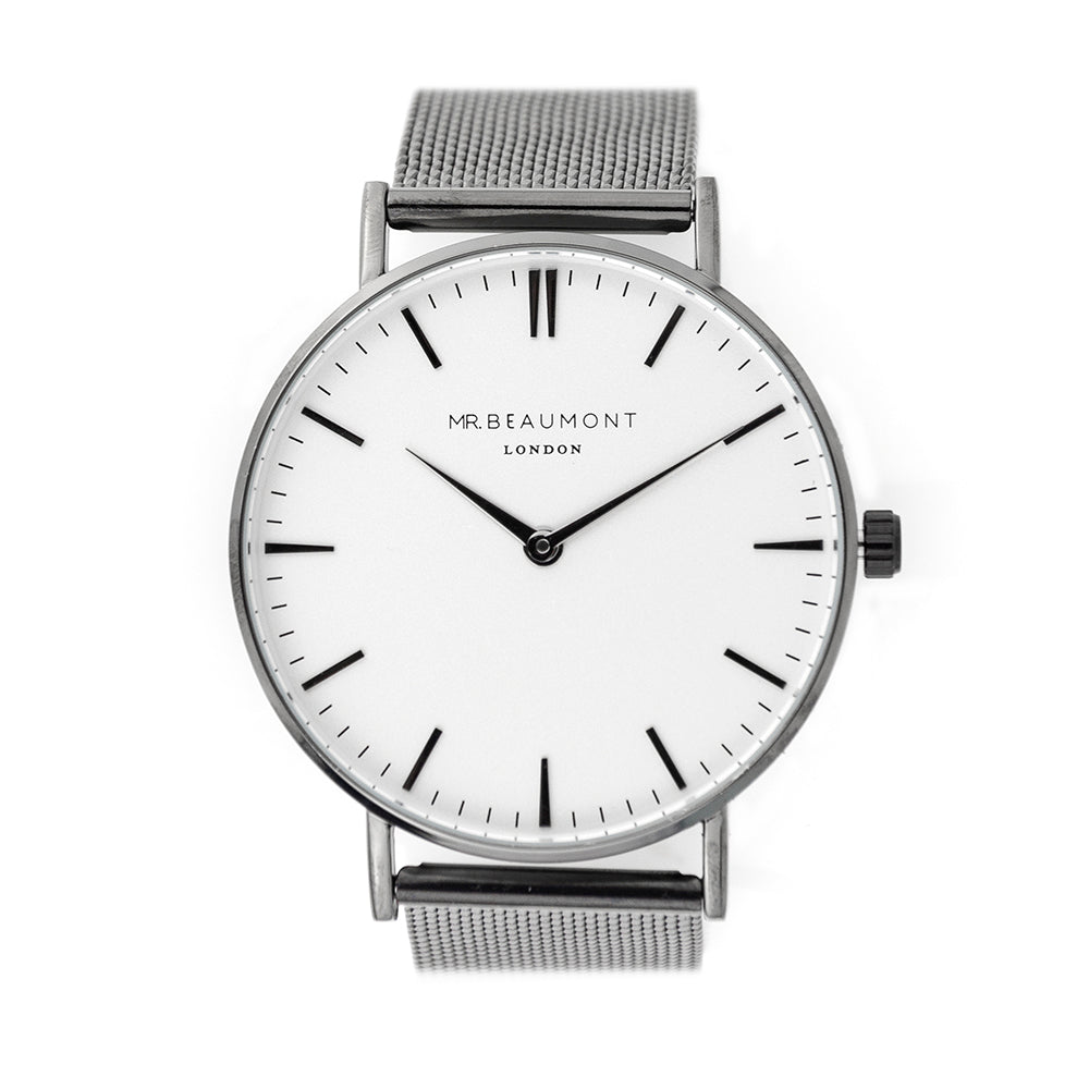 Silver watch with a white face on a white background