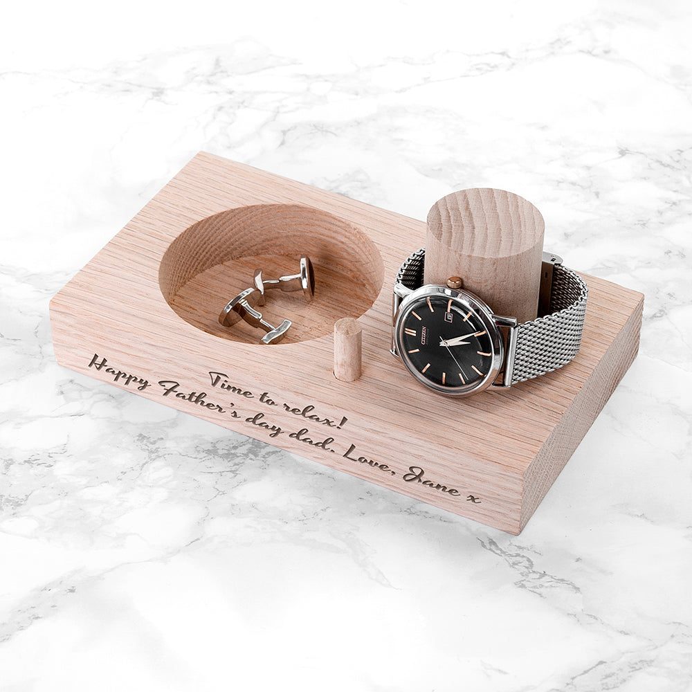 Wooden display stand with watch and cufflinks on a marble surface