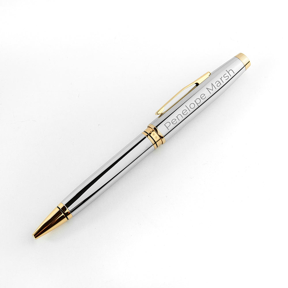 Silver pen with gold accents on a white background