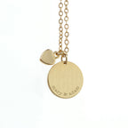 Silver necklace with a round pendant featuring the name 'ella' and butterfly designs on a white background.