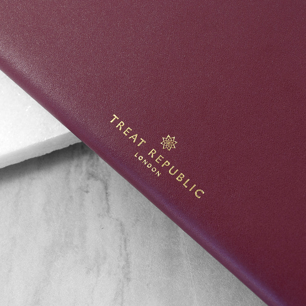 Maroon product with 'Treat Republic London' logo on a marble surface