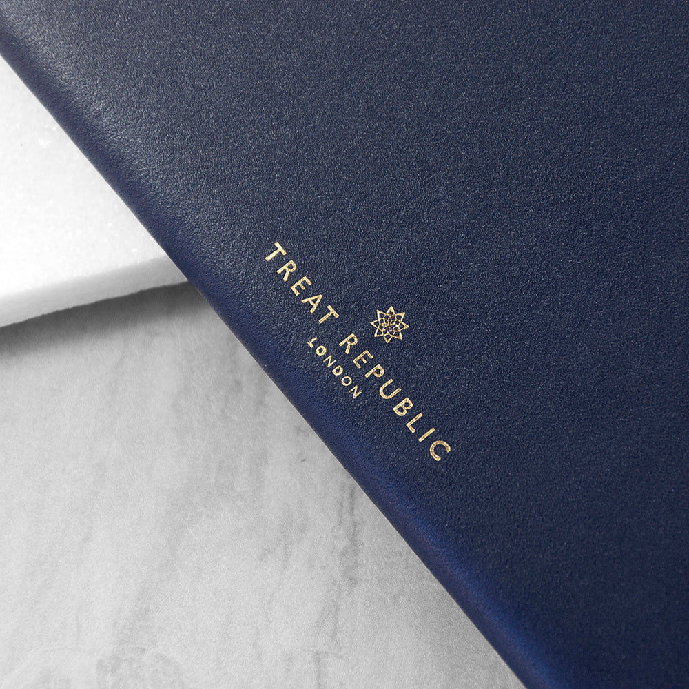 Navy blue product with 'Treat Republic London' logo on a light gray background