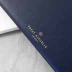 Navy blue product with 'Treat Republic London' logo on a light gray background