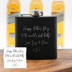 Black flask with personalized message in front of beer bottles