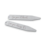 Two silver hair clips with engraved messages on a white background