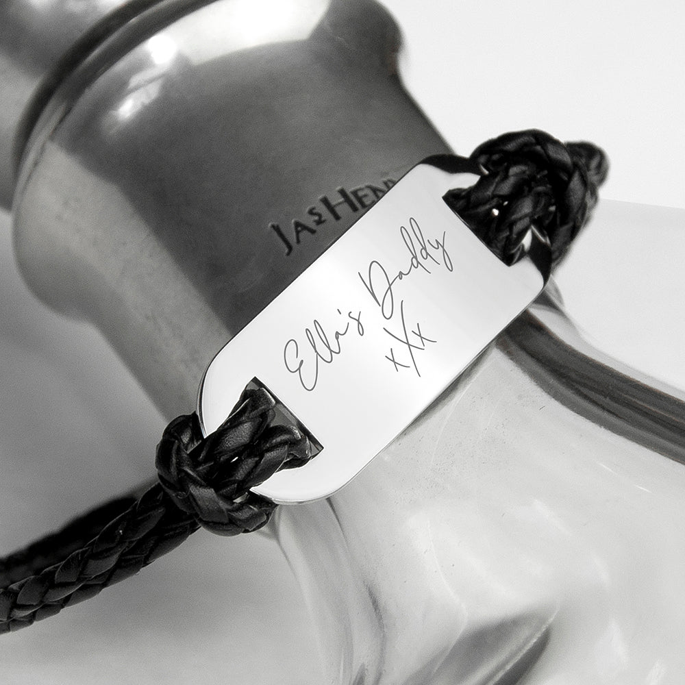 Bracelet with engraved message on a glass bottle background