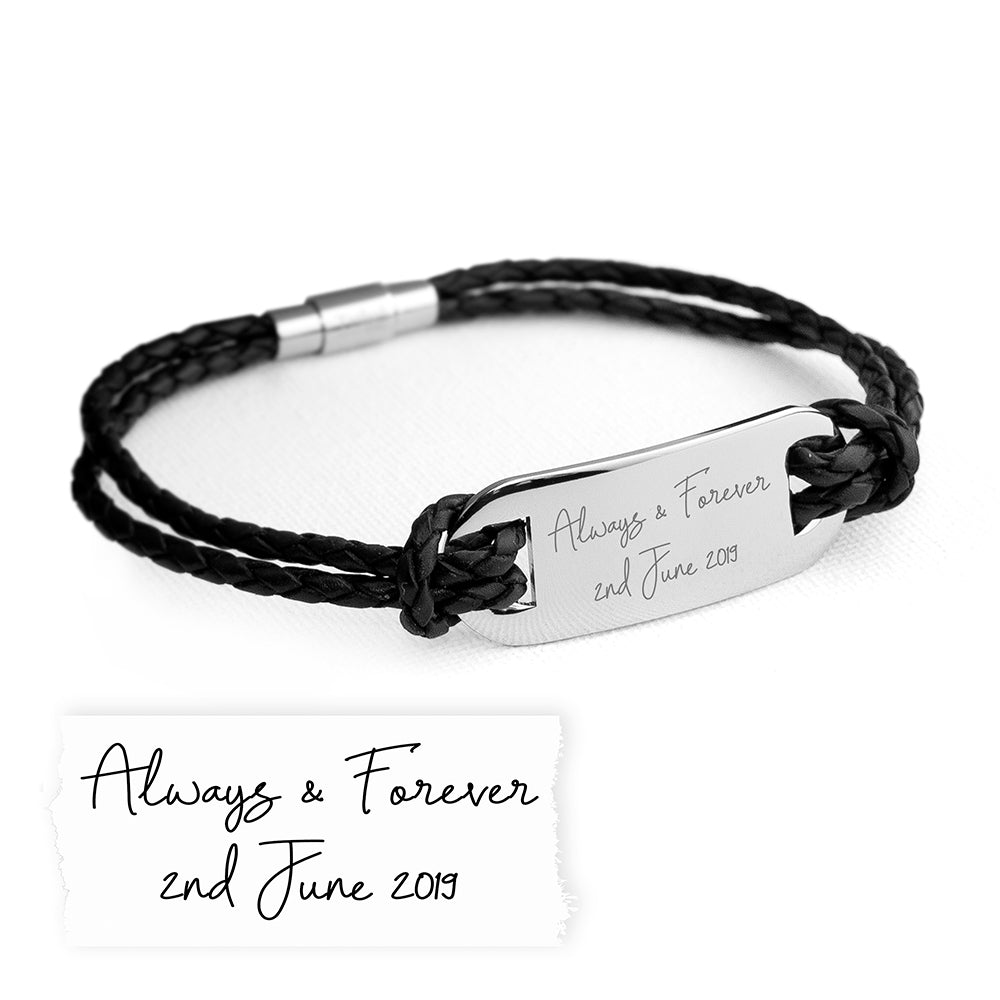 Black braided leather bracelet with silver tag on a white background