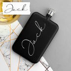 Black flask with 'Jack' engraving on a marble surface