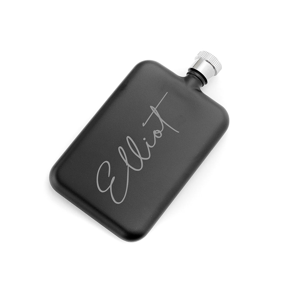 Black flask with 'Elliot' engraving on a white background