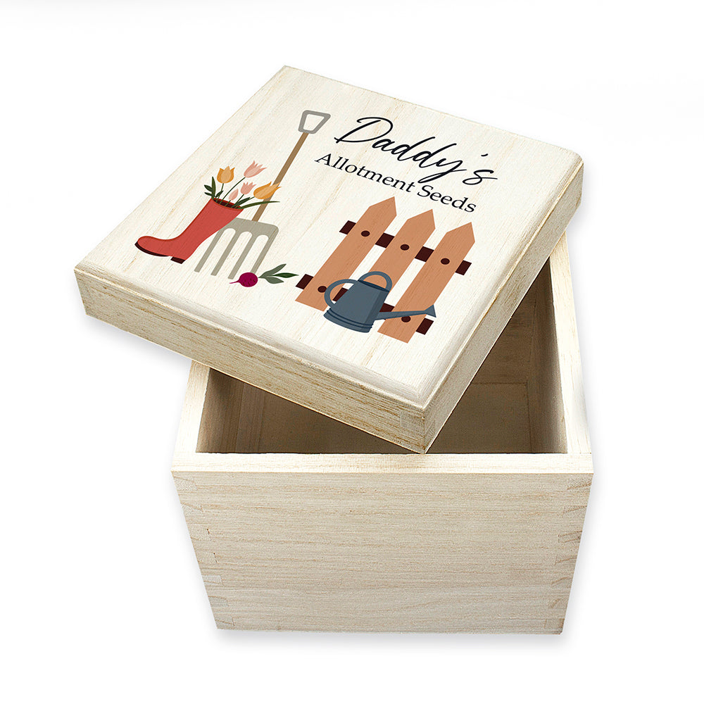 Wooden box with garden-themed design and 'Daddy's Allotment Seeds' text on a white background