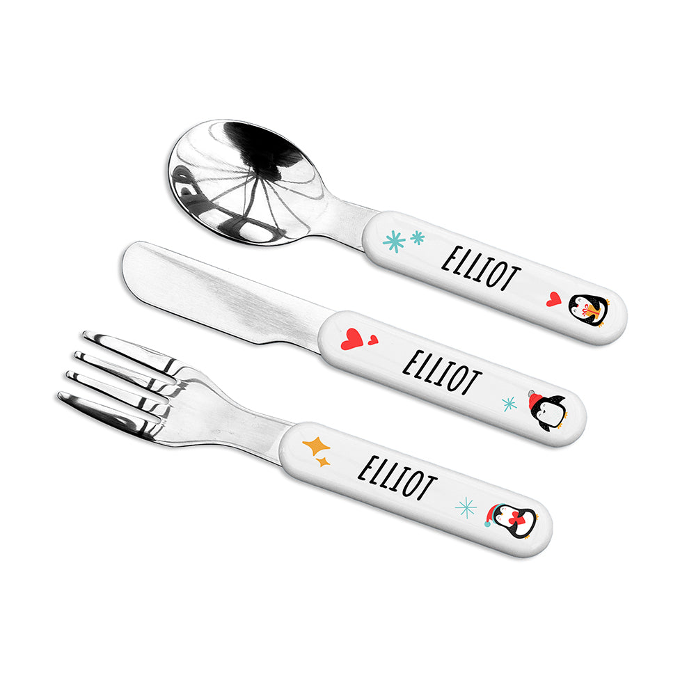 Children's cutlery set with 'ELLIOT' engraved on handles on a white background