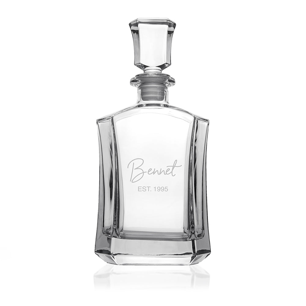 Clear glass decanter with 'Bennet' branding on a white background