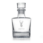 Clear glass decanter with 'W' and 'Wallace' engraving on a white background