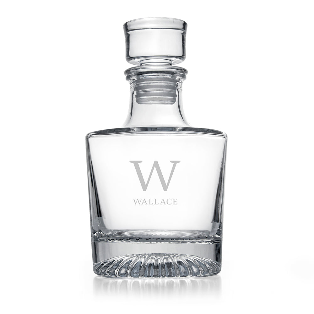 Clear glass decanter with 'W' and 'Wallace' engraving on a white background