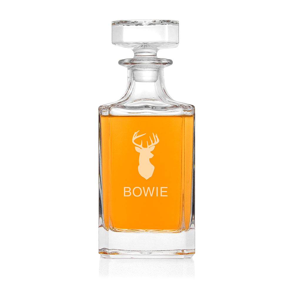 Clear glass decanter with amber liquid and 'Bowie' branding on a white background