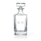Clear glass decanter with 'Wallace' branding on a white background