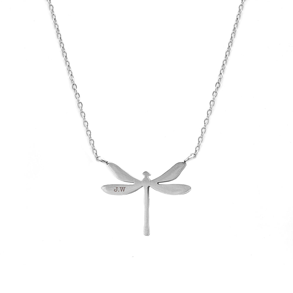 Silver dragonfly pendant necklace on a white background