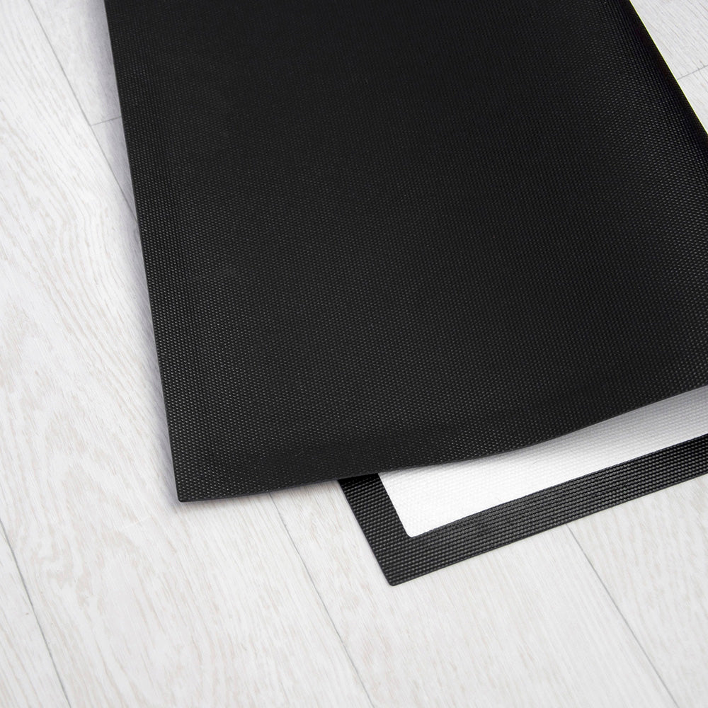 Black mat on a white wooden floor