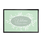 Framed artwork with 'Welcome to Grandma's House' text on a light green background