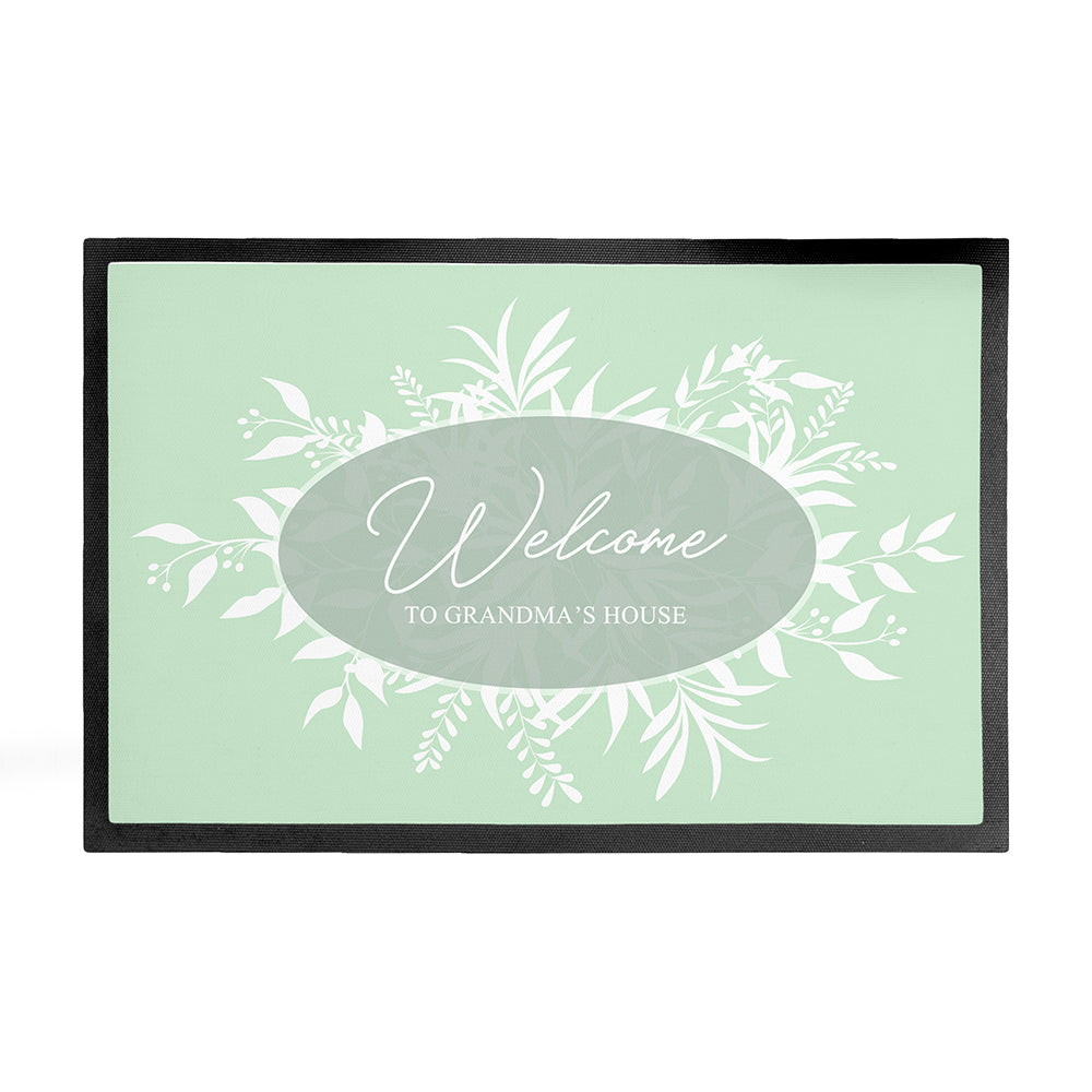 Framed artwork with 'Welcome to Grandma's House' text on a light green background