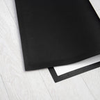 Black mat on a white wooden floor