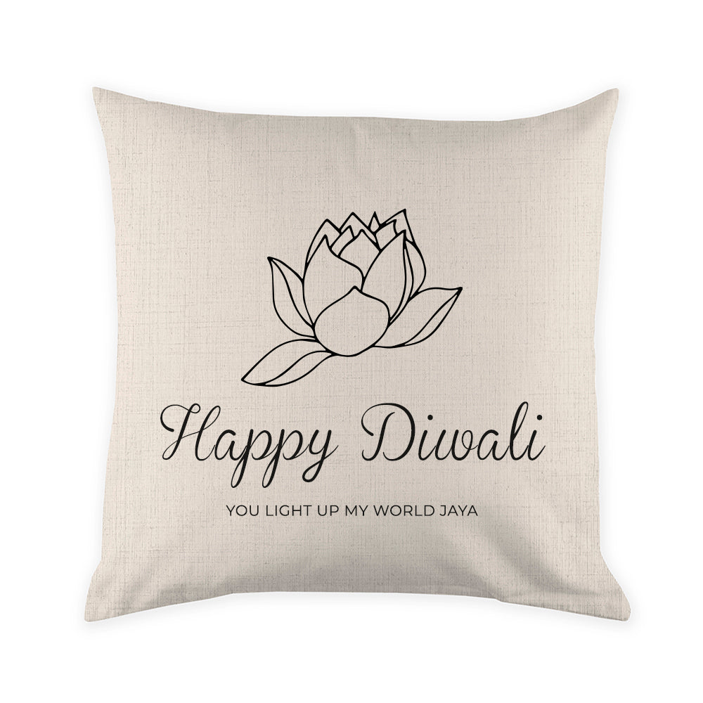 Decorative pillow with a lotus design and 'Happy Diwali' text on a beige background